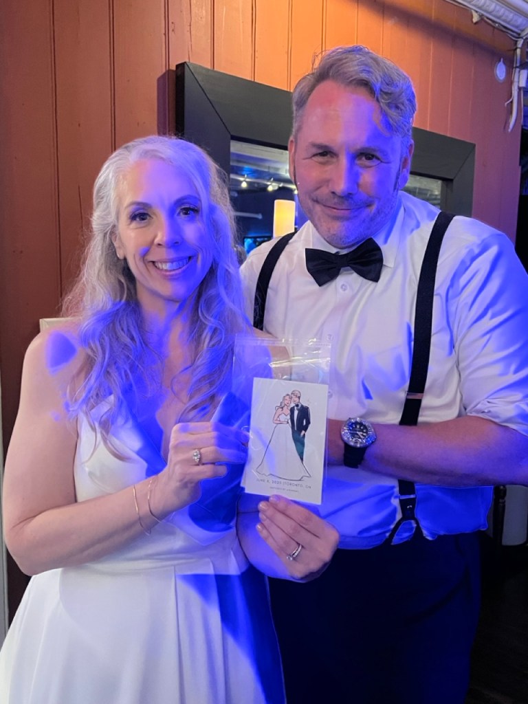 Picture of Bride and Groom with their beautifully hand made sketch by tehremy artist