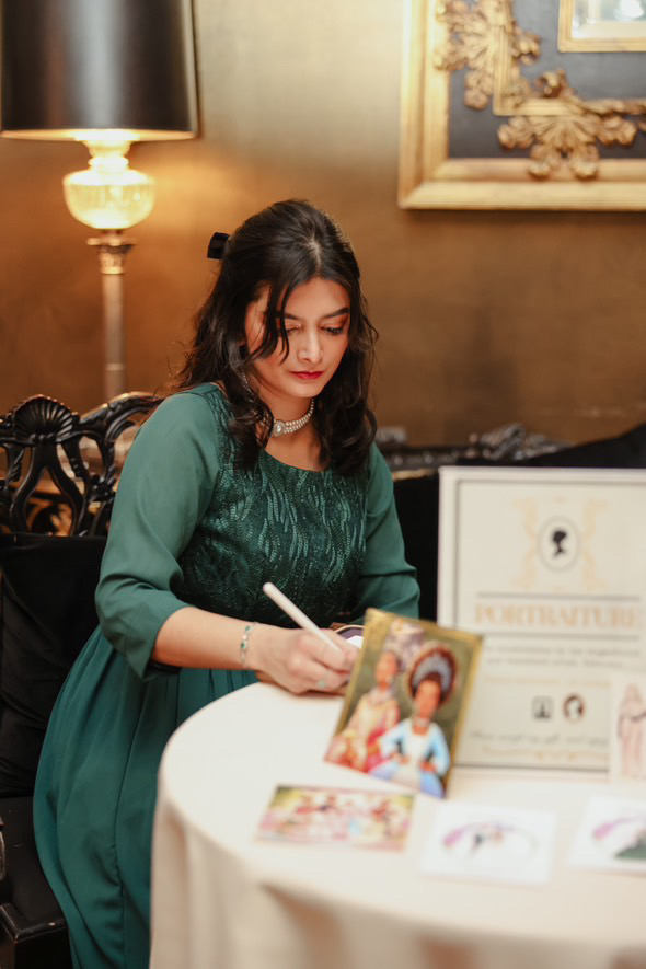 Tehremy artist sitting and drawing live guest sketches