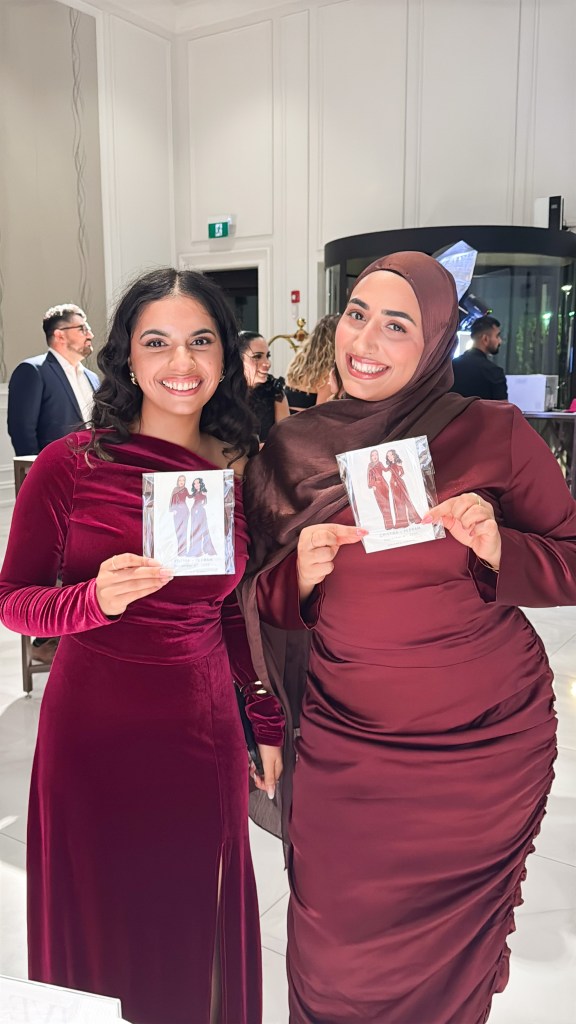 photo of two girls holding thei custom tehremy live fashion illustrations